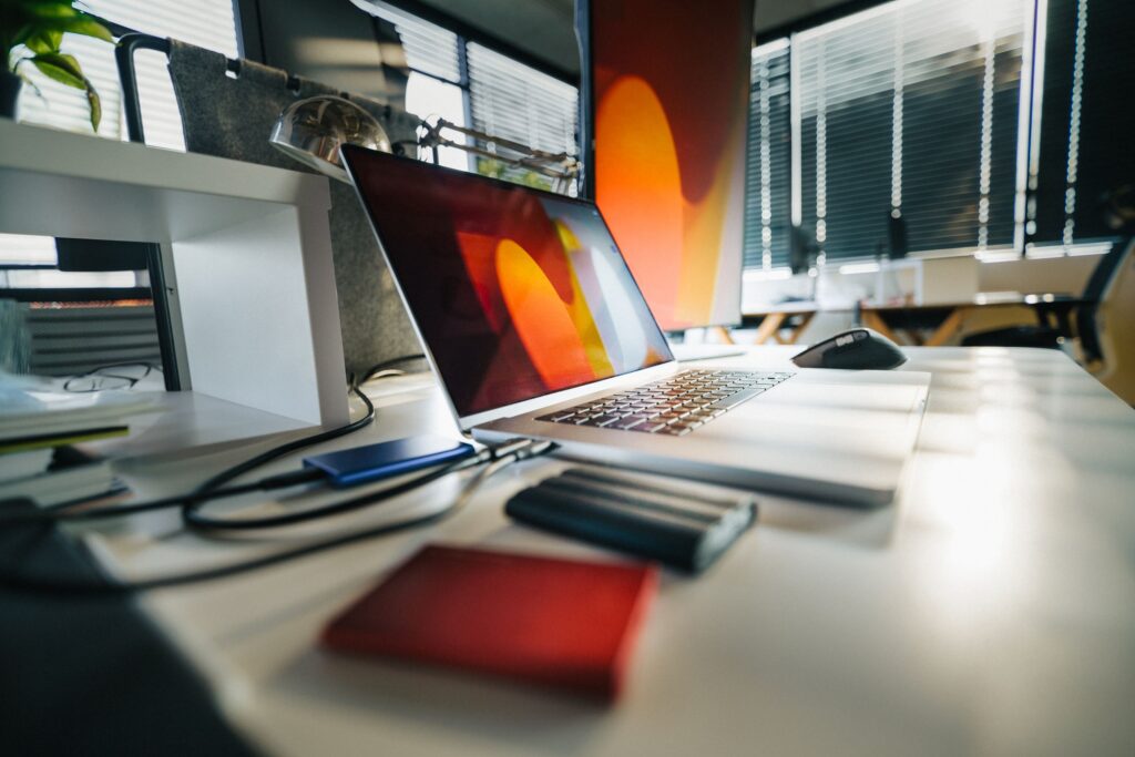Modern workspace with laptop and external drives for data backup