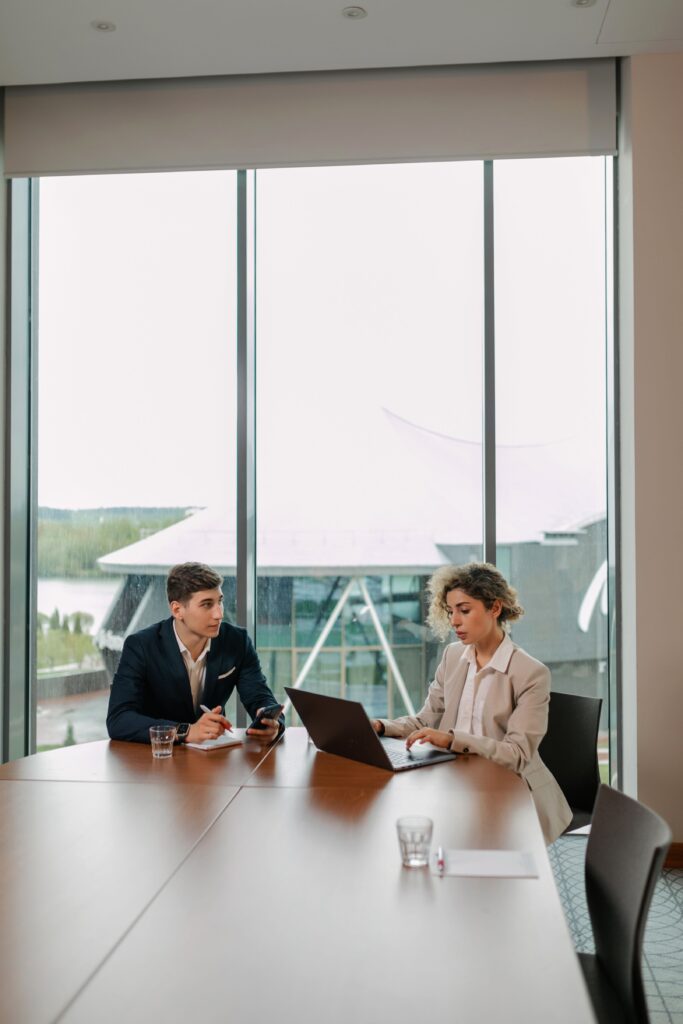 Two professionals discussing website and technology requirements