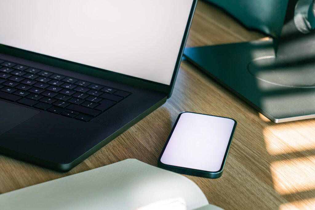 Modern laptop and smartphone workspace for connected digital operations
