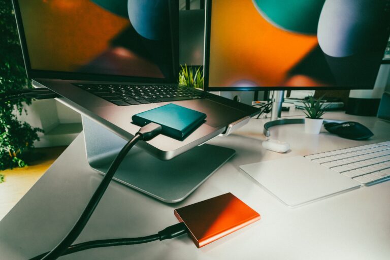 Laptop with connected external storage drives for backup and recovery