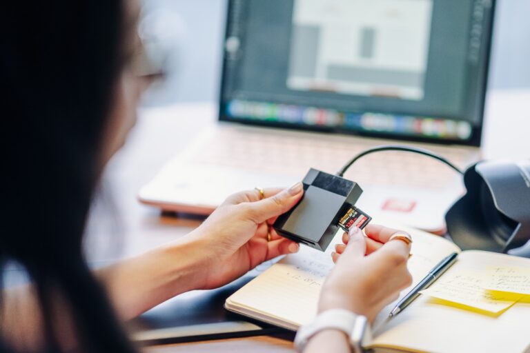 Digital media being transferred from storage into a laptop workflow