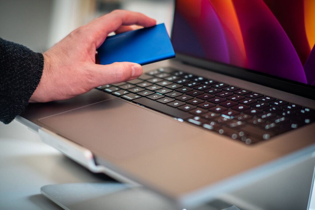 External backup drive being connected to a laptop