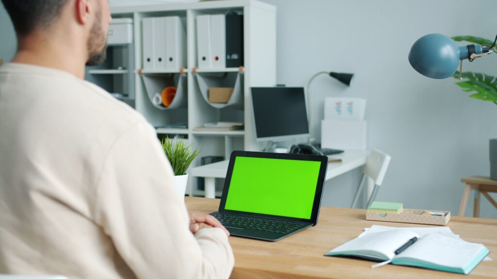 Small business professional working with a laptop in a home office
