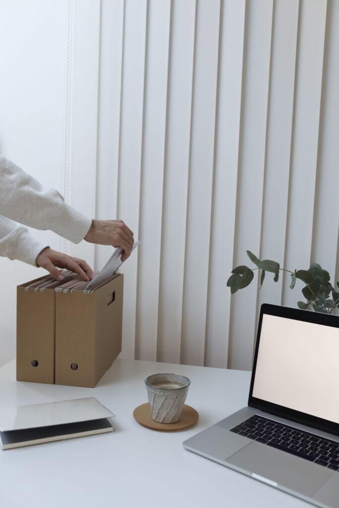 Organised office workspace with laptop and business documents