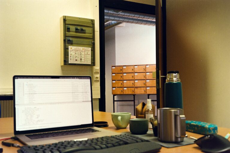 Laptop workspace used for website development and maintenance